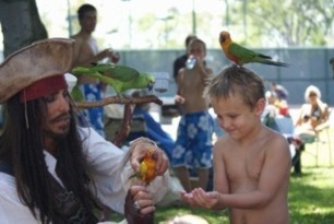 parrot show at a pirate theme children's birthday party with Captain Parrot Jack