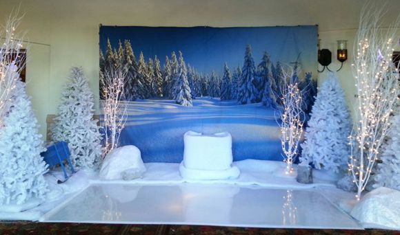 snow scene event decoration with simulated ice floor and artificial snow.
